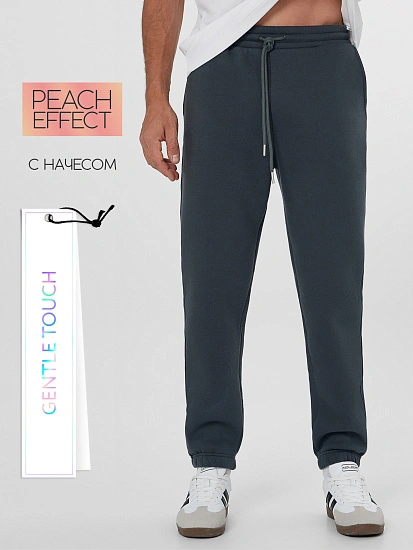 картинка Теплые брюки джоггеры мужские зеленые с начесом от магазина мужской одежды Mark Formelle