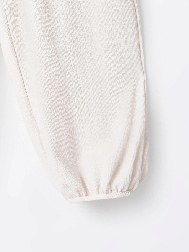 Брюки джоггеры женские молочные свободного кроя - 6